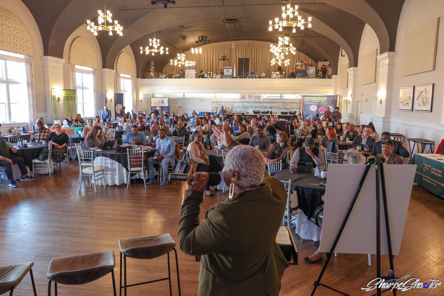 Speaker addressing a full room of business owners