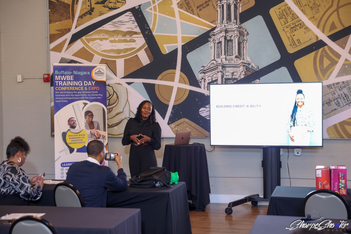 A facilitator teaching a business credit session to small business owners